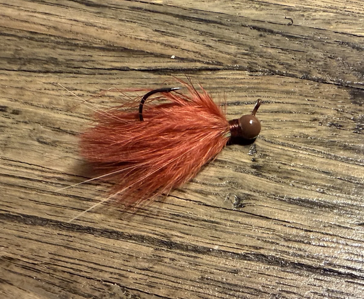 Dark-colored 3/32-ounce hand-tied hair jig