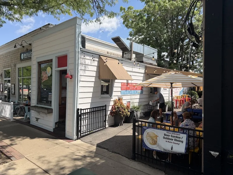 Side entrance and hidden patio at Atlas Chicken Shack in Geneva, Illinois