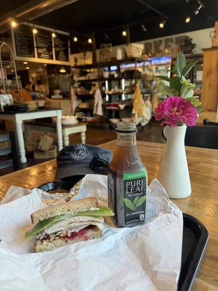 Turkey sandwich with stuffing and cranberry sauce inside Deane's Market and Deli