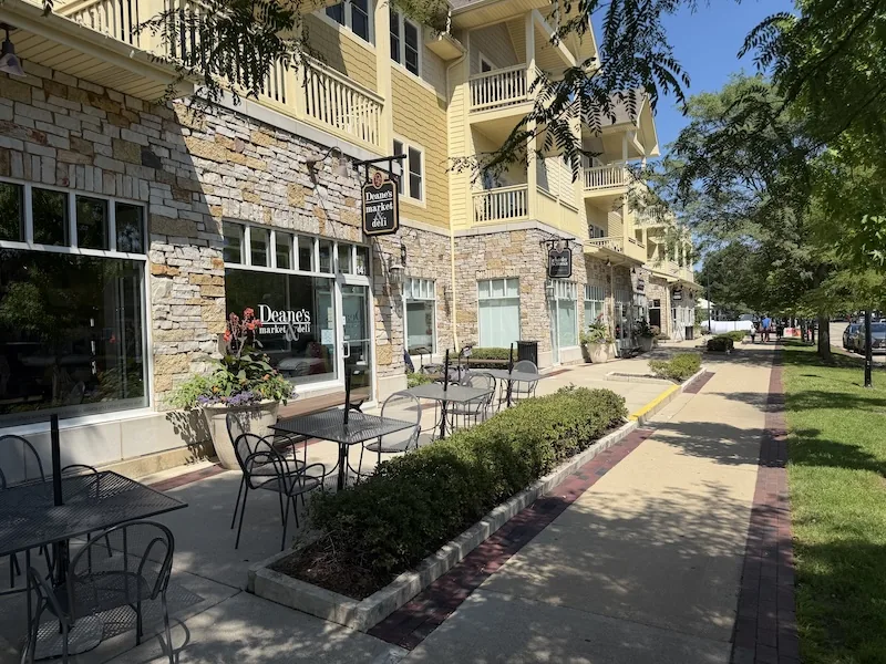 Deane's Market and Deli storefront and sidewalk tables in Geneva, Illinois