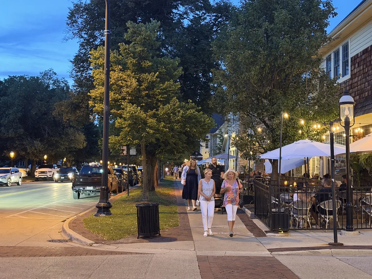 People walking along Third Street after dinner in Geneva, Illinois