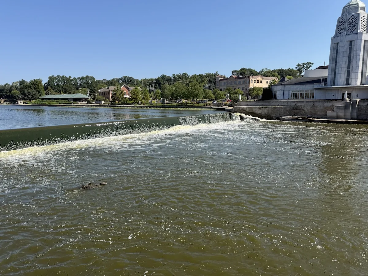 The downtown St. Charles dam and Municipal Building with Pottawatomie Park in the distance